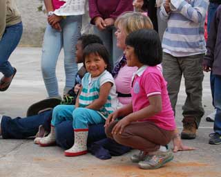 Guest with local children; Ecuador